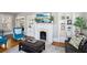 Comfortable living room with a decorative fireplace and mantelpiece, accompanied by built-in shelves and plenty of decor at 313 5Th Ne St, Atlanta, GA 30308