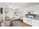 Cozy living space with a comfortable bed, functional kitchen, and dining area in a bright, modern setting at 313 5Th Ne St, Atlanta, GA 30308