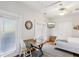 Bright living space featuring a bed, dining area, and TV, creating a cozy and functional living area at 313 5Th Ne St, Atlanta, GA 30308