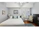 Comfortable main bedroom with natural light, hardwood floors, and soothing decor at 313 5Th Ne St, Atlanta, GA 30308