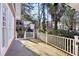 Side porch with white railing, offering outdoor enjoyment and relaxation space at 313 5Th Ne St, Atlanta, GA 30308