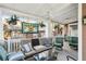 Inviting porch with ample seating, ceiling fans, and charming decorative elements at 313 5Th Ne St, Atlanta, GA 30308