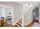 Traditional staircase with wood treads and white risers leads to the second floor at 313 5Th Ne St, Atlanta, GA 30308