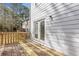 This home features a back deck with wood railings that provide a private outdoor living area at 5940 Hampton Ct, Atlanta, GA 30349