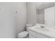 Bathroom with a large mirror, toilet, and vanity with a white countertop at 5940 Hampton Ct, Atlanta, GA 30349