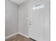Bright entryway featuring new hardwood flooring and a modern white front door at 5940 Hampton Ct, Atlanta, GA 30349