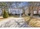 Charming townhome featuring a well-manicured front yard with mature trees and a private driveway at 5940 Hampton Ct, Atlanta, GA 30349