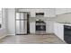 A clean kitchen with stainless steel appliances, white cabinets, and modern countertops at 5940 Hampton Ct, Atlanta, GA 30349