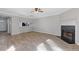 Open floor plan living room with luxury vinyl plank flooring and cozy fireplace at 5940 Hampton Ct, Atlanta, GA 30349