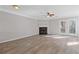 Bright living room featuring luxury vinyl plank flooring and cozy fireplace at 5940 Hampton Ct, Atlanta, GA 30349