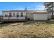 Home features a yard with a wood deck and siding at 9515 Deerfield Ln, Jonesboro, GA 30238