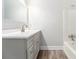 This bathroom has a modern vanity with a sleek countertop and mirror at 9515 Deerfield Ln, Jonesboro, GA 30238