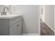 This bathroom features a modern gray vanity with brushed metal hardware at 9515 Deerfield Ln, Jonesboro, GA 30238
