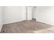 Bedroom with neutral walls, plush carpet, and closet for storage at 9515 Deerfield Ln, Jonesboro, GA 30238