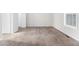 Bedroom featuring carpet, large window for natural light, and closet at 9515 Deerfield Ln, Jonesboro, GA 30238