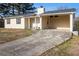 Lovely single-story house with light yellow siding and a convenient attached carport at 9515 Deerfield Ln, Jonesboro, GA 30238