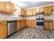 Well-equipped kitchen with stainless steel appliances, sleek countertops, and ample cabinetry at 9515 Deerfield Ln, Jonesboro, GA 30238