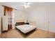 Bedroom with natural light, minimalist headboard, decorative curtain, and neutral carpet at 1000 Beckwith Sw St, Atlanta, GA 30314