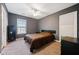 Cozy bedroom features neutral walls, carpet, and plenty of natural light from the window at 1000 Beckwith Sw St, Atlanta, GA 30314