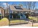 Charming bungalow-style home featuring a well-maintained front yard and a secure iron fence with mailbox at 1000 Beckwith Sw St, Atlanta, GA 30314