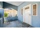 Inviting front porch featuring a slate floor, white front door and space for seating to enjoy quiet moments at 1000 Beckwith Sw St, Atlanta, GA 30314