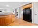 Kitchen area with wooden cabinets, black appliances, and granite countertops at 1000 Beckwith Sw St, Atlanta, GA 30314