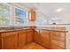 Well-lit kitchen featuring wooden cabinets and granite countertops at 1000 Beckwith Sw St, Atlanta, GA 30314