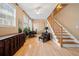 Sunlit living room featuring gleaming hardwood floors, staircase, and ample space for comfortable seating and decor at 1000 Beckwith Sw St, Atlanta, GA 30314