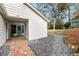 View of the backyard with stone and wood features leading up to home entrance at 2327 Ewing Ne Dr, Brookhaven, GA 30319