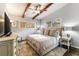 Serene bedroom with exposed beams, soft lighting, and hardwood floors at 2327 Ewing Ne Dr, Brookhaven, GA 30319