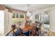 Elegant dining room with a chandelier, access to the screened porch, and large windows for natural light at 2327 Ewing Ne Dr, Brookhaven, GA 30319