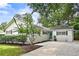 Charming one-story home featuring a brick foundation, light-colored siding, and well-manicured landscaping at 2327 Ewing Ne Dr, Brookhaven, GA 30319