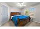 Bedroom featuring a queen bed, ceiling fan, window and light gray walls at 4005 Princeton Trce, Cumming, GA 30041