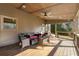 Comfortable covered deck with wicker seating, a ceiling fan, and views of the backyard at 4005 Princeton Trce, Cumming, GA 30041