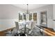 Modern dining room with stylish lighting, contemporary table, and access to the screened porch at 4005 Princeton Trce, Cumming, GA 30041