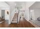 Bright foyer with hardwood floors and a staircase leading to the second floor at 4005 Princeton Trce, Cumming, GA 30041