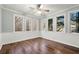 Bright sunroom with wood flooring and multiple windows offering a view of the outdoors at 4005 Princeton Trce, Cumming, GA 30041