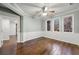 Bright sunroom with wood flooring and multiple windows offering a view of the outdoors at 4005 Princeton Trce, Cumming, GA 30041