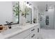 Modern bathroom with double vanity, marble countertops, and a glass-enclosed shower at 836 Bailey Woods Rd, Dacula, GA 30019