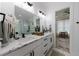 Modern bathroom features dual sink vanity, glass shower, and neutral color scheme at 836 Bailey Woods Rd, Dacula, GA 30019