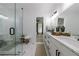 Modern bathroom features dual sink vanity, glass shower, and neutral color scheme at 836 Bailey Woods Rd, Dacula, GA 30019