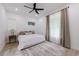 Bright bedroom with fan, light colored walls, and large windows at 836 Bailey Woods Rd, Dacula, GA 30019