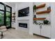 Cozy interior view of fireplace, shelves, decor, and modern design, and exterior view through large windows at 836 Bailey Woods Rd, Dacula, GA 30019