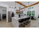 Modern kitchen featuring a large island with seating, stainless steel appliances, and natural wood accents at 836 Bailey Woods Rd, Dacula, GA 30019