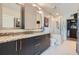 Modern bathroom with granite countertops, double sinks, glass shower, and walk-in closet at 1080 Peachtree Ne St # 1812, Atlanta, GA 30309