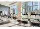 Bright gym featuring treadmills and exercise bikes in front of large windows offering city views at 1080 Peachtree Ne St # 1812, Atlanta, GA 30309