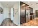 Modern condo featuring a kitchen with stainless steel appliances and a light-filled entryway with hardwood floors at 1080 Peachtree Ne St # 1812, Atlanta, GA 30309