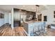 Inviting condo featuring open kitchen with island seating, stainless steel appliances, and wood floors at 1080 Peachtree Ne St # 1812, Atlanta, GA 30309