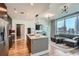 Contemporary living space with a chef's kitchen and an open-concept living area with city skyline views at 1080 Peachtree Ne St # 1812, Atlanta, GA 30309