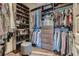 Well-organized walk-in closet with custom shelving and ample space for clothes and accessories at 1080 Peachtree Ne St # 1812, Atlanta, GA 30309
